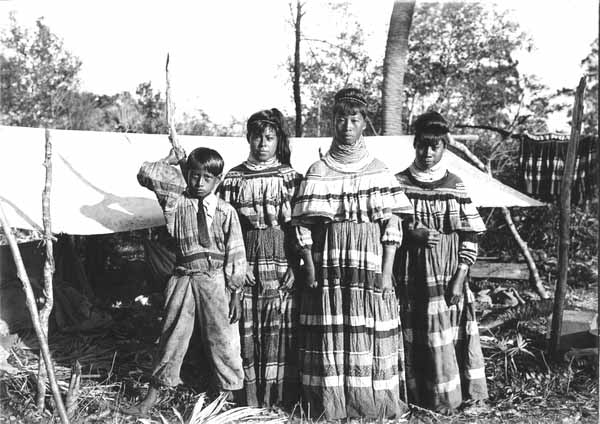 Photo of four members of a Seminole Family
